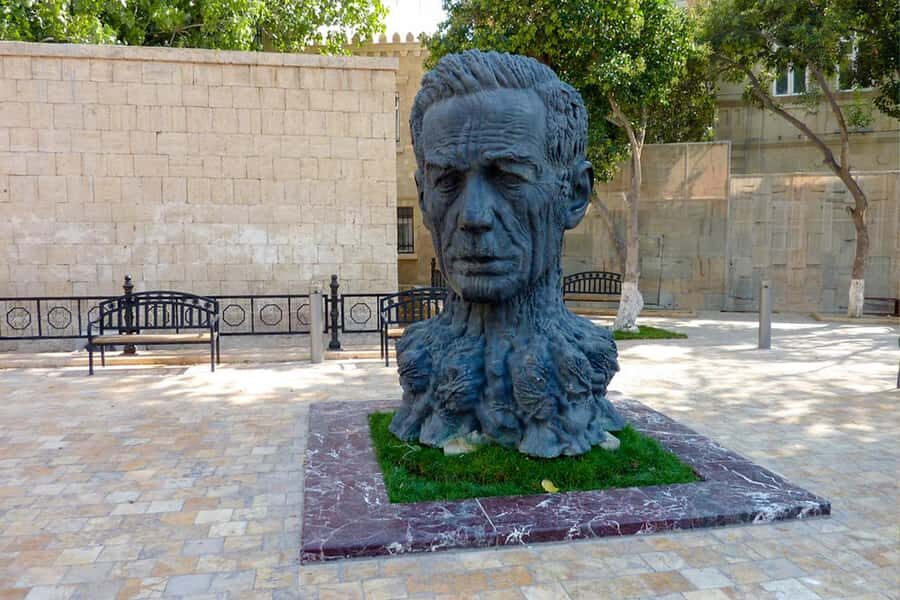 Baku: Old City Guided Walking Tour - Quick Photo Stops: Bukhara Caravanserai and Madonna Seafaring