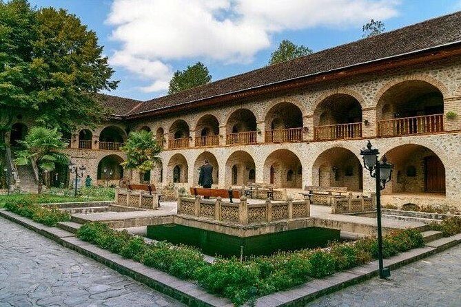 Sheki tour with overnight - Stop 4: Church of Kish museum—trilingual learning and glass-covered graves
